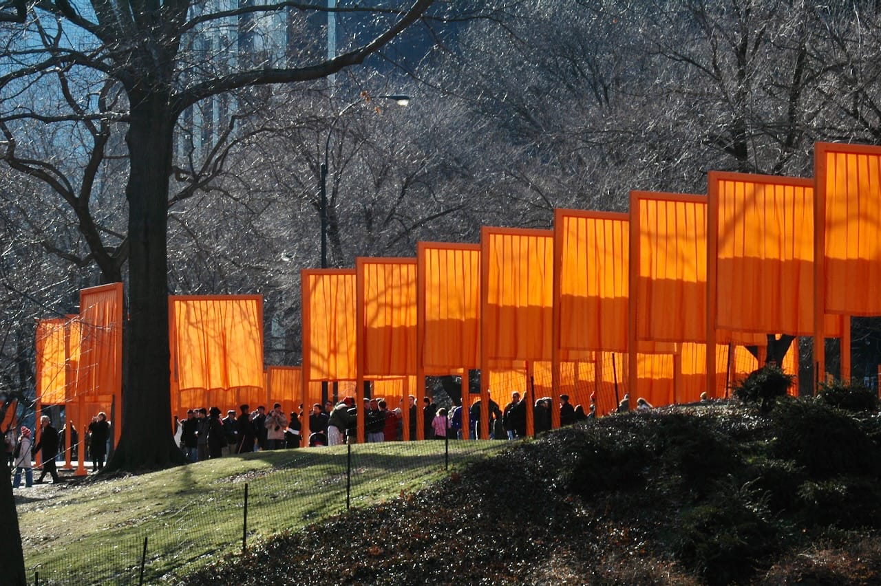 People walking under the orange gates in Central Park