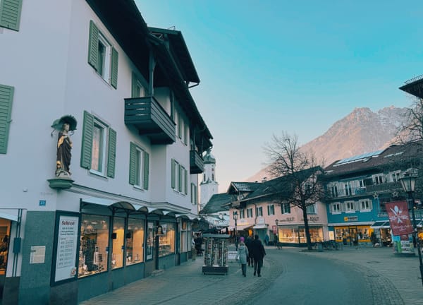 Street view of Garmisch=Partenkirchen with mountain backdrop.