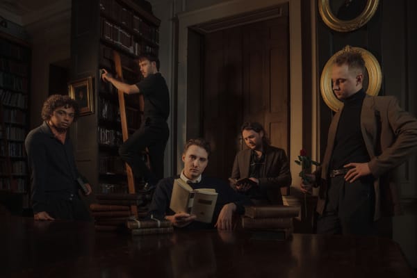 Pressshot of the Nottingham, England based band Victory Lap - it shows the five male members in a library, in a very moody se